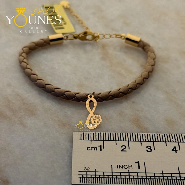 دستبند چرم گل بینهایت طلا